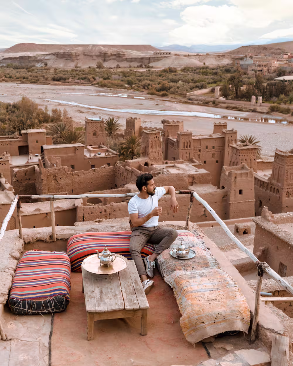 bearded man drinking coffee on the terrace